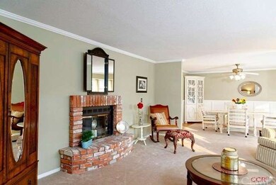 The living room and dining room are a perfect comp