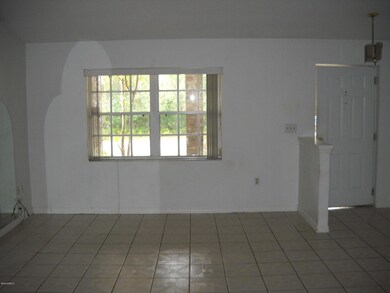 Tiled Living room with vaulted ceiling