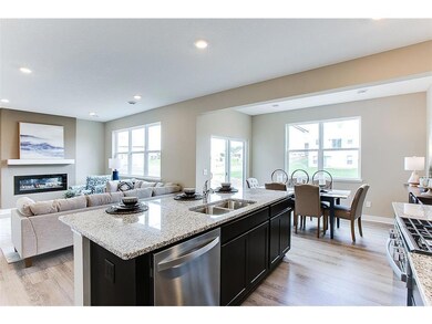 The open concept living-kitchen-dining setup! *Model photo, selections and colors may vary!