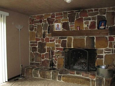 Den/Family/Great Room. Stone wood burning fireplac