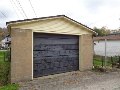 Parking Lot/Garage. Detached one car garage.