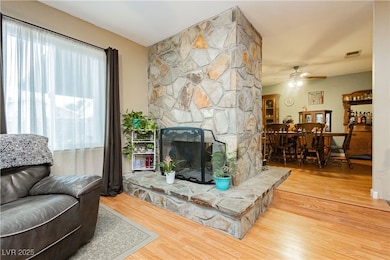 Living room featuring wood finished floors, ceilin