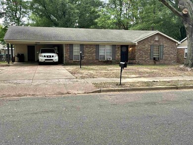 Single story home with a carport