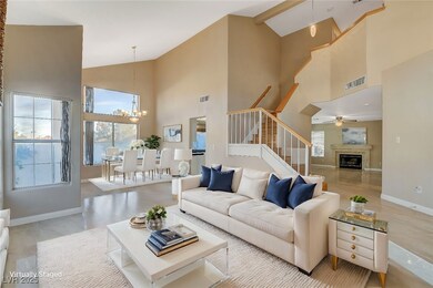 Living area featuring baseboards, visible vents, a