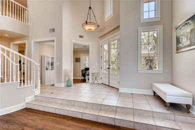 Neutral and stylish entryway/foyer with bright ope