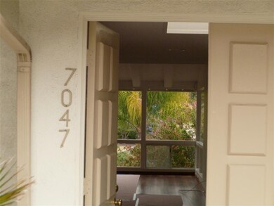 Welcome into skylighted entryway to living room