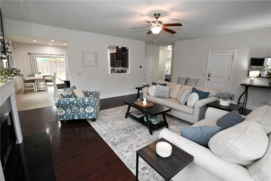 Living area flows into kitchen & dining.