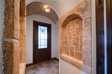 Entryway featuring lofted ceiling