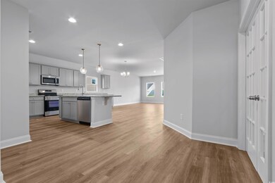 Kitchen featuring stainless steel appliances, wood