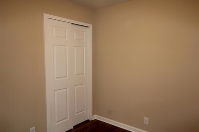 One of the three bedrooms. All with hardwood floors and new paint, lights & doors.
