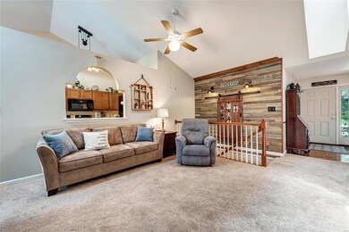 Reclaimed wood accent wall over the stairs.