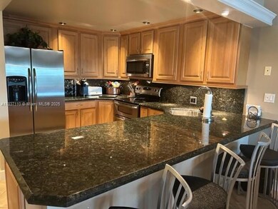 Beautifully updated granite kitchen w/ countertop seating