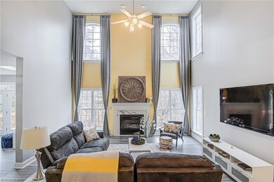 The two story wows you with its long windows .Bright and sunny. The beautiful drapes matching the decor remain