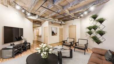 The living area seamlessly flows into the kitchen,
