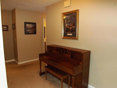 The large foyer leads to the living room on the left and directly to the kitchen and dining area. A convenient coat closet is located in the foyer. 