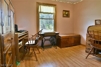 Office featuring light wood-style flooring and baseboards