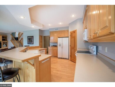 Kitchen features ample maple cabinetry, center isl