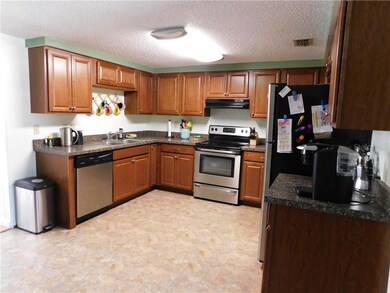 Open kitchen with an abundance of cabinets and counterspace