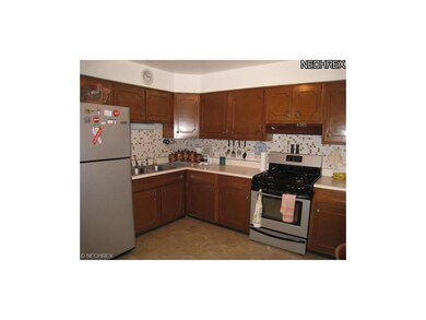 Open kitchen with stainless steel appliances.