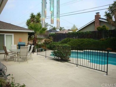Patio Area, Fenced  Pool and Yard beyond.