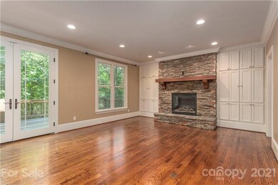 Great room with gleaming wood floors, vented gas f