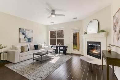 Living area with a fireplace with flush hearth, d