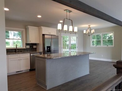 EXPOSED BEAM AND OPEN FLOOR PLAN