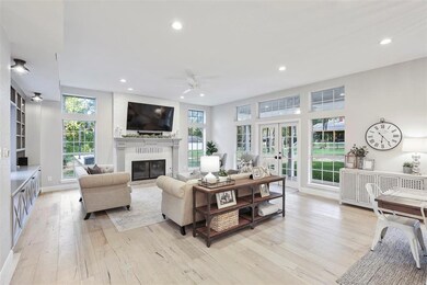 Impressive floor-to-ceiling windows flood the home