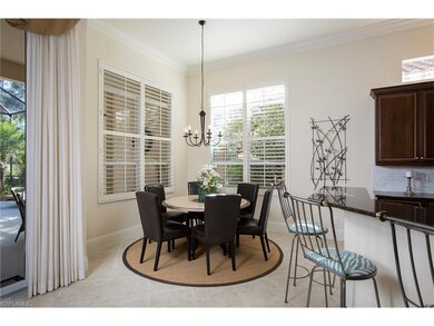 Light and bright morning room has plantation shutt