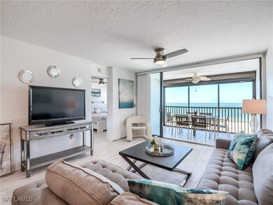 Tiled and stylishly furnished living area with wal