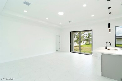 Unfurnished living room with a raised ceiling and