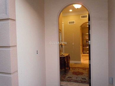 Entry Hall. An arched front door greets you as you