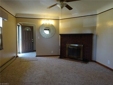 LIVING ROOM WITH WOOD BURNING FIREPLACE