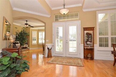 Entry way with crown molding, plantation shutters 