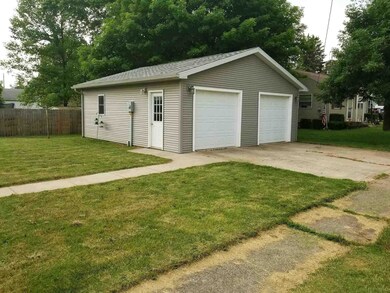2-car garage and concrete driveway.