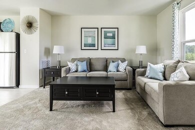 Spacious living room open to the kitchen.  *Model Home photo.