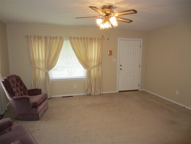 The spacious Living Room has hardwood floors under