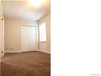 2nd bedroom with new carpet and fresh coat of pain
