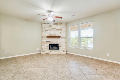 Unfurnished living room featuring a ceiling fan, 