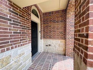 Property entrance with brick siding