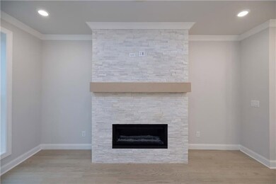 This home will have a stacked quartzite surround like the one shown in this photo. *Please note the photos shown are representative of the plan but are not of the actual home.