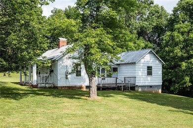 Side view of farm house looking toward side deck.