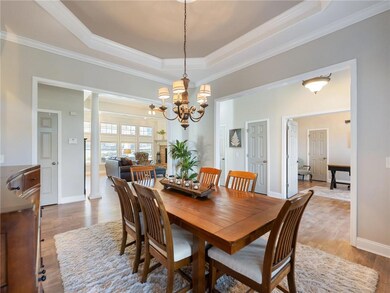 Dining space with light wood-type flooring, a tray