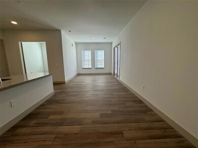 Corridor with dark hardwood / wood-style floors