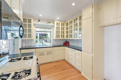 Upgraded Kitchen looks out on backyard, very brigh