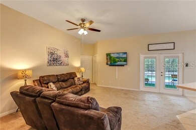 Living Room overlooking Salt Water Pool and Lanai