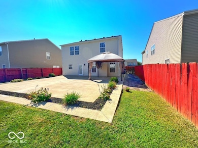 rear view of property with a pergula, a patio, and a fenced backyard