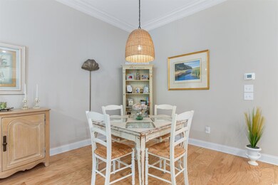 Dining area with light wood-style floors, ornament