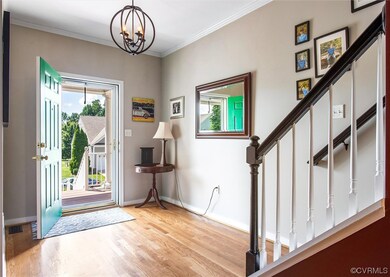 Hardwood floored entrance foyer with plenty of nat