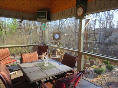 Large screened deck with tile floor.  TV on deck conveys!